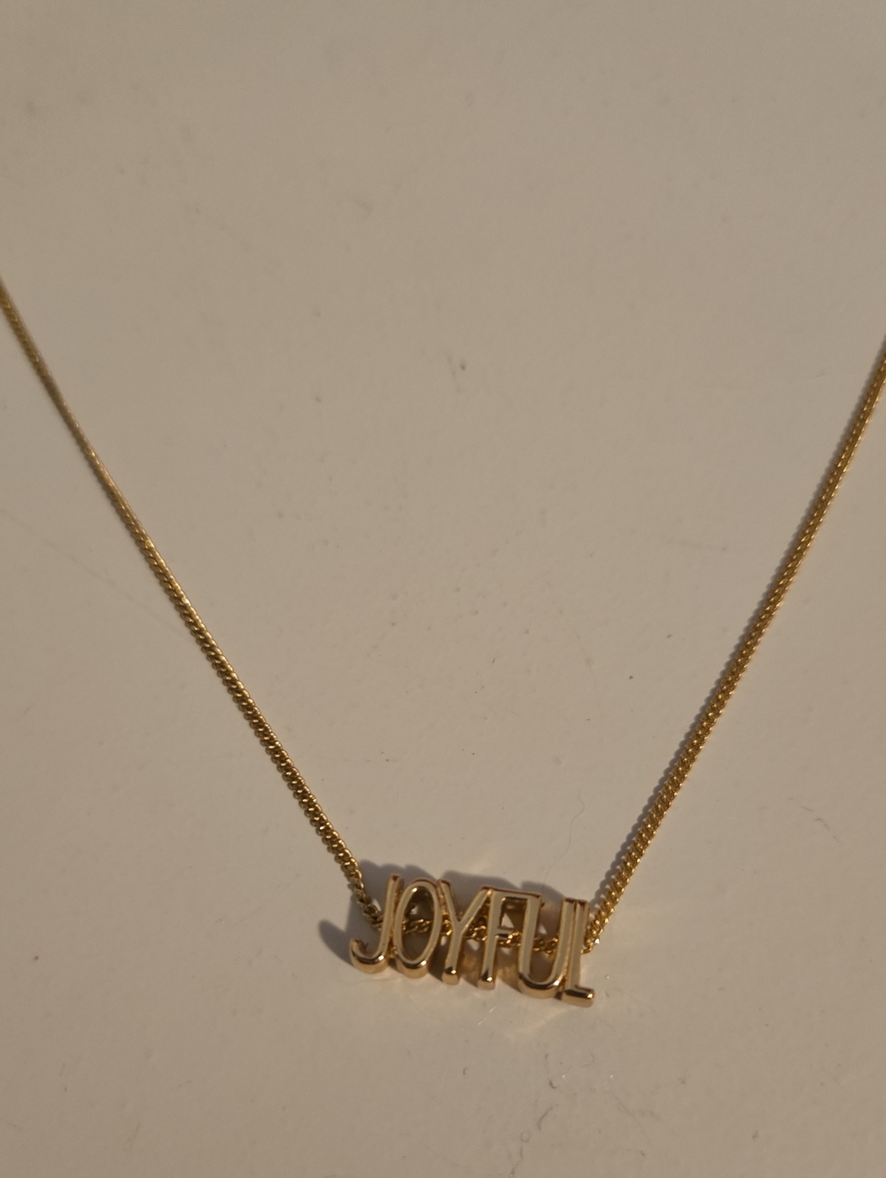Joyful Gold-Tone Pendant Necklace